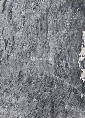 Closeup of gray marble texture with veins.
