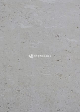 Close-up of light gray textured stone surface