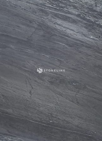 Close-up of dark textured stone surface