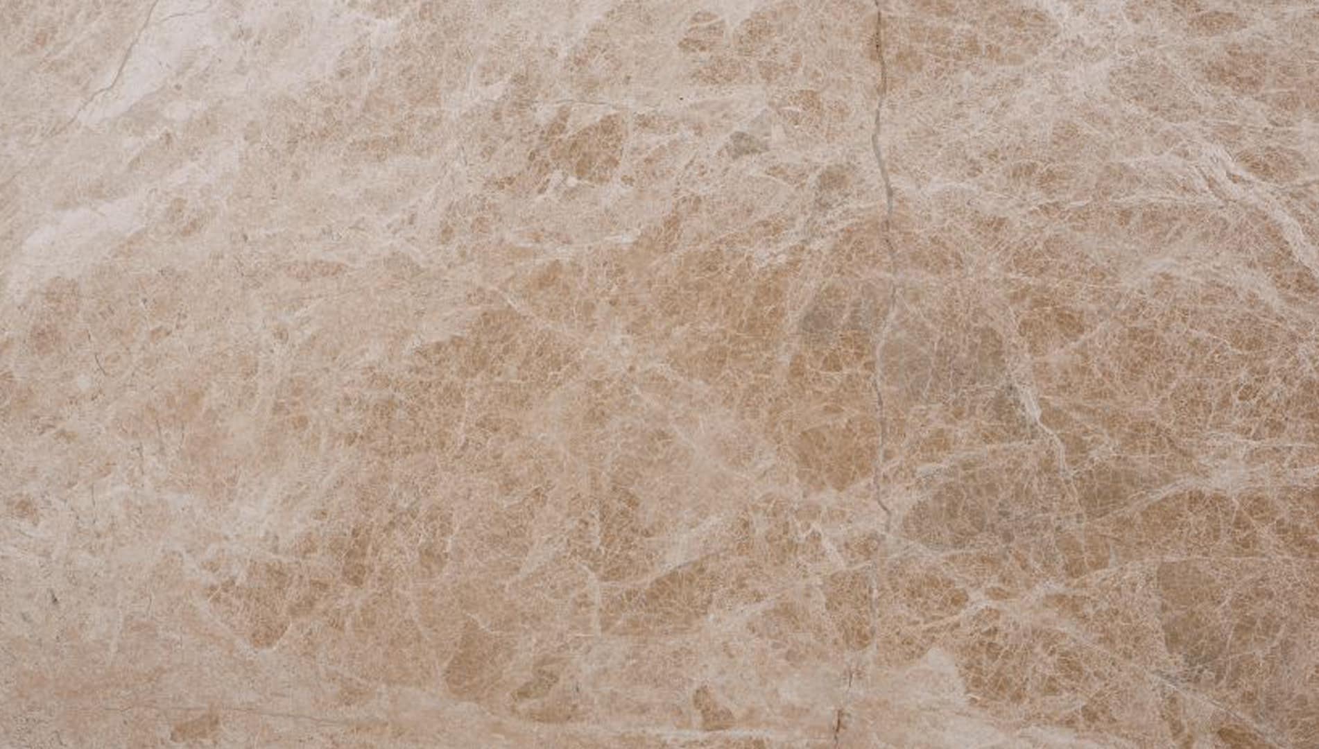 Beige marble texture with natural patterns.