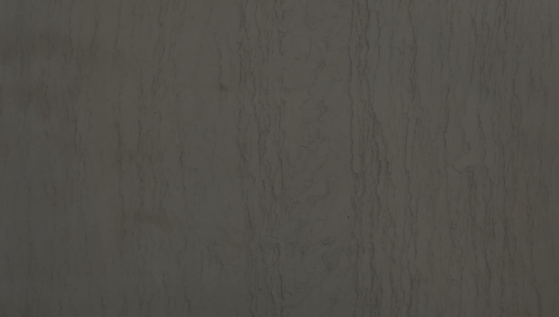 Dark textured stone surface background.