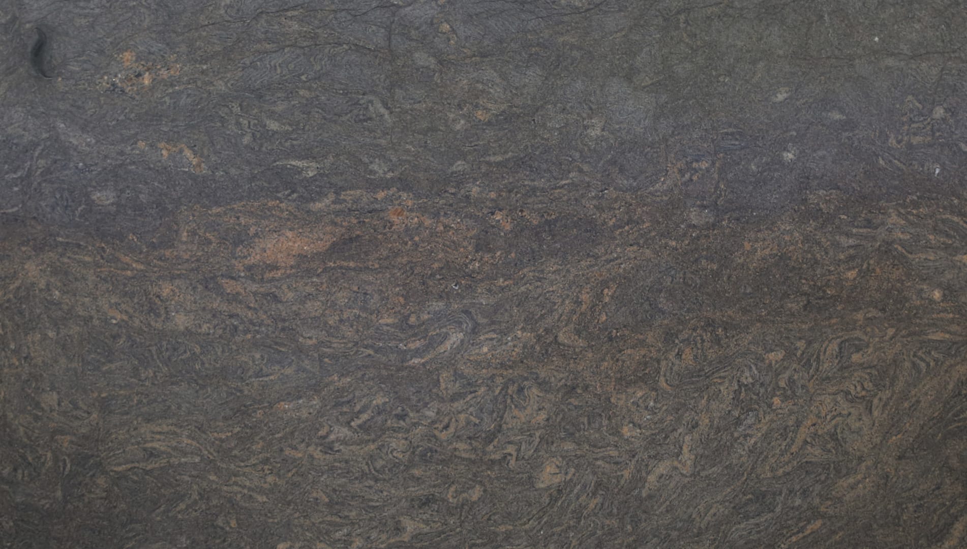 Close-up of textured dark rock surface.
