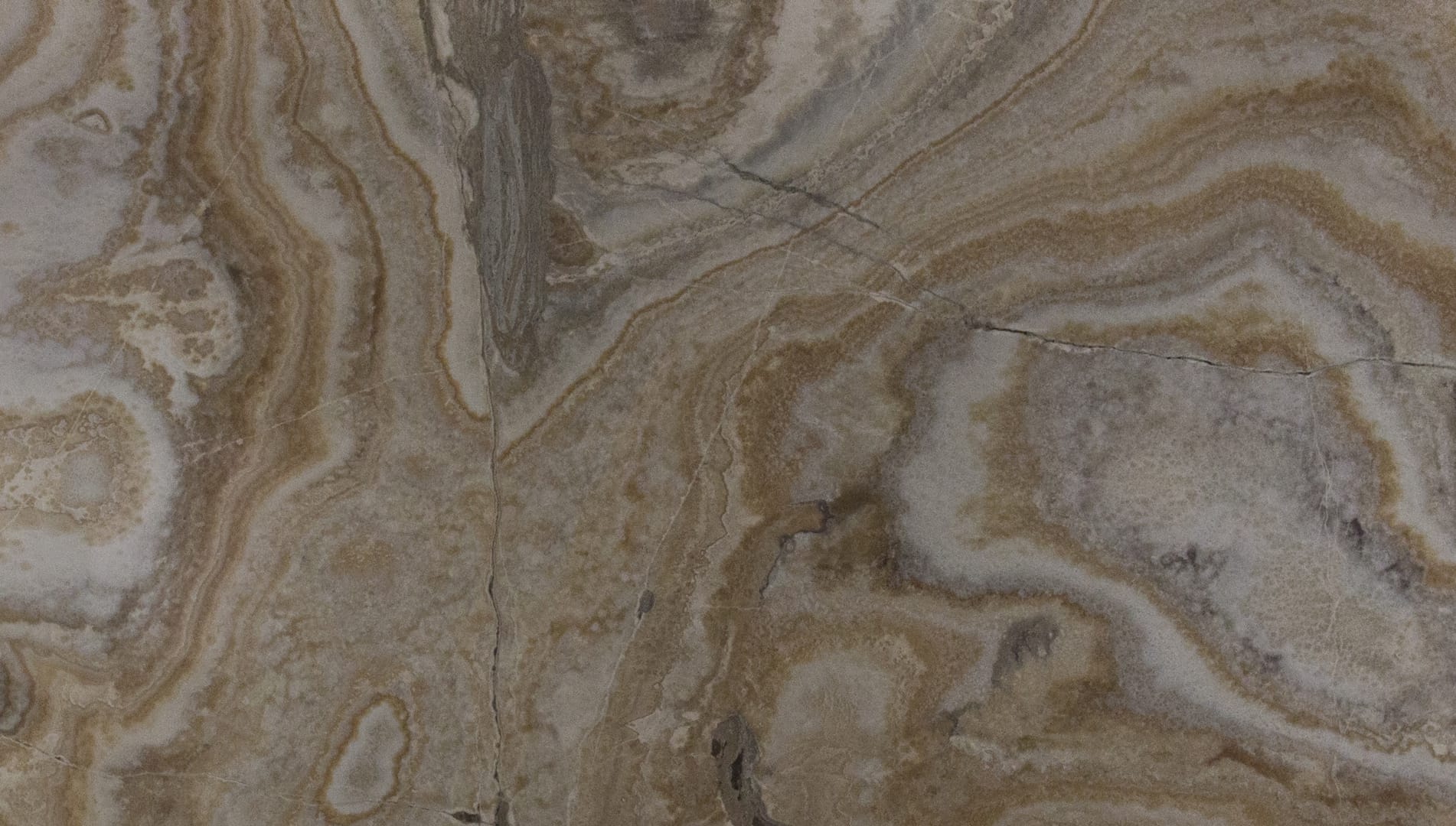 Close-up of textured brown and gray marble surface.
