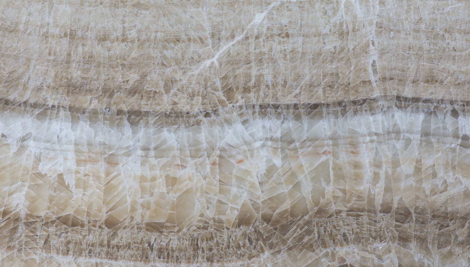 Close-up of beige onyx marble texture.