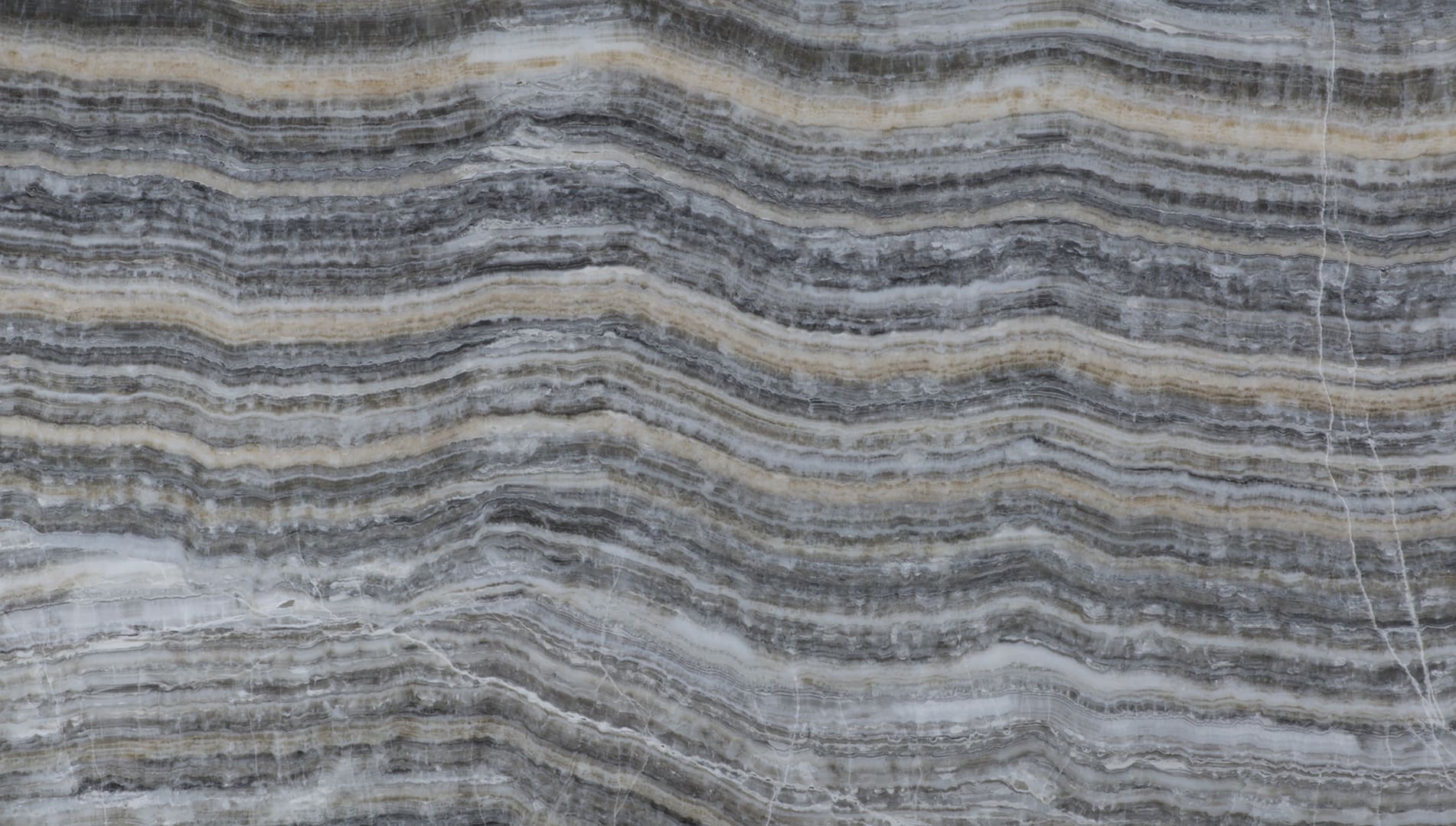 Patterned brown and gray stone surface texture.
