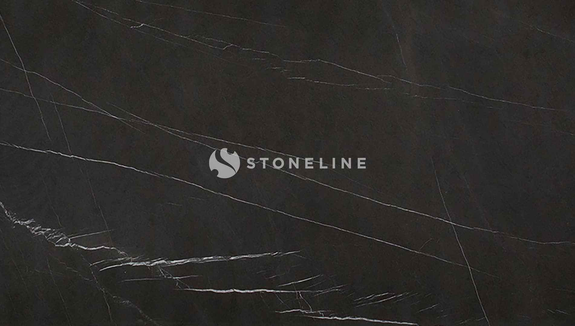 Dark marble surface with fine white veins.