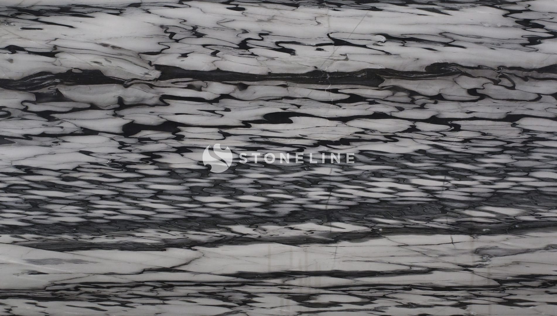 Close-up of textured black and white marble surface.