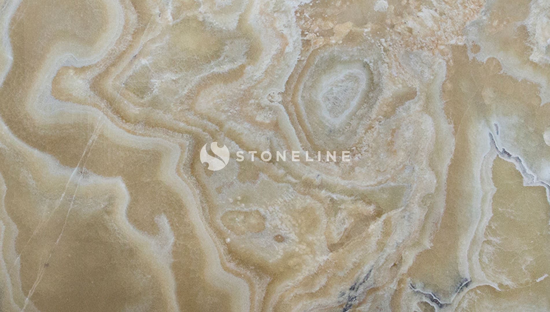 Close-up of beige marble texture with swirls.