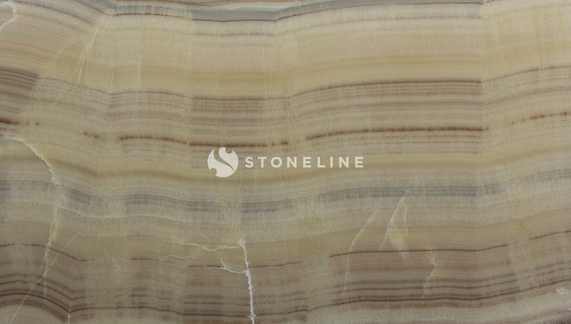 Close-up of beige onyx stone texture and patterns.