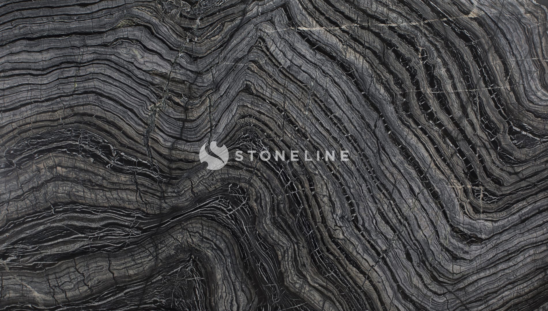 Close-up of swirling black and gray marble pattern.