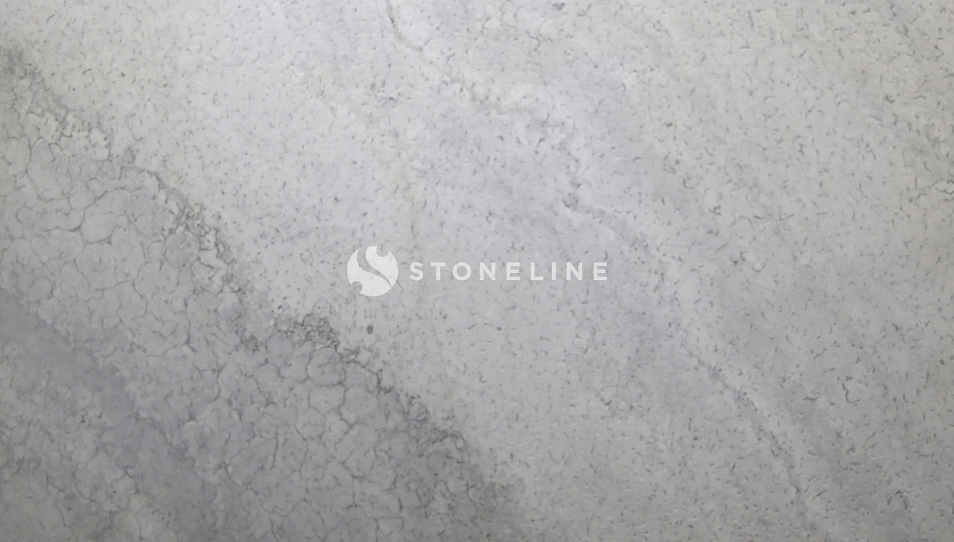 Close-up of textured gray concrete wall surface.