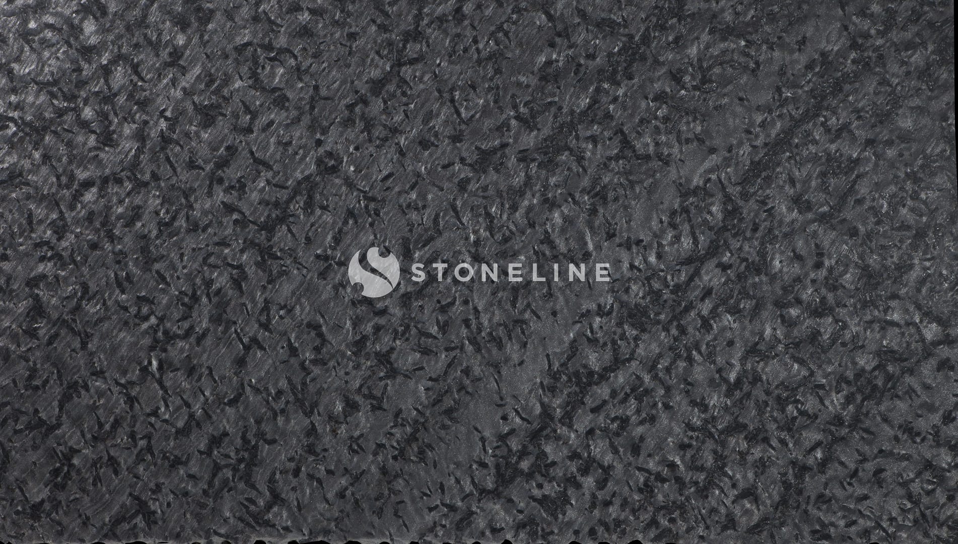 Dark, textured surface with irregular patterns.