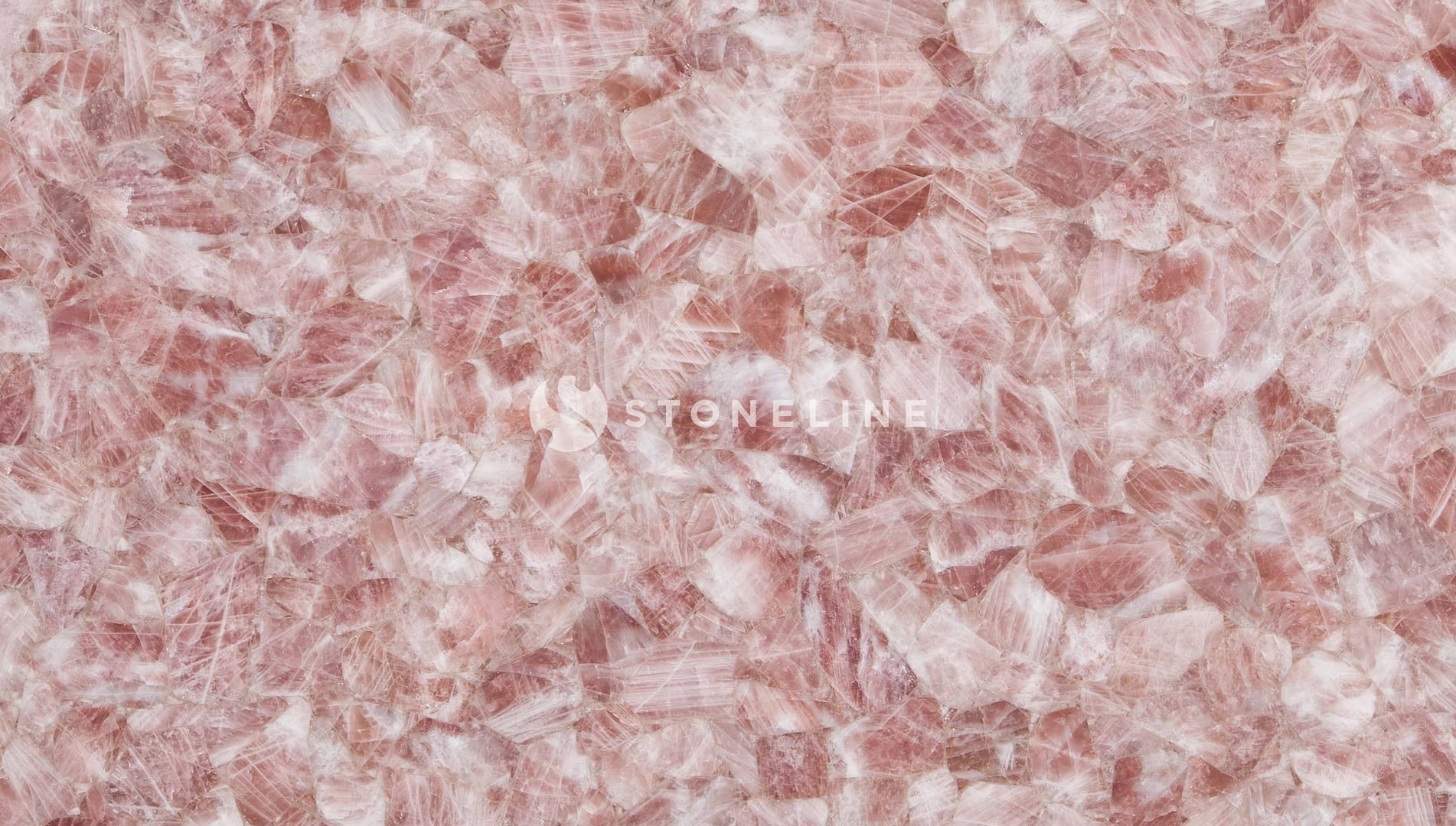 Textured pink rose quartz stone surface