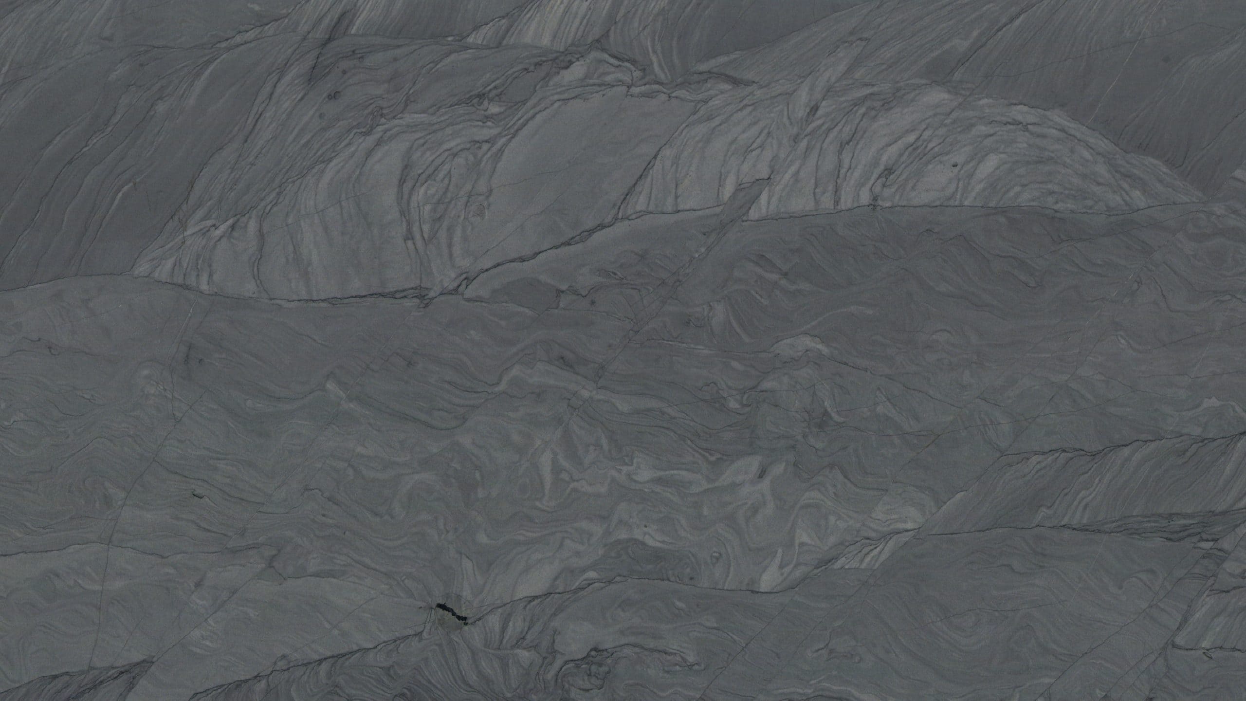 Gray marble texture with natural veining patterns.