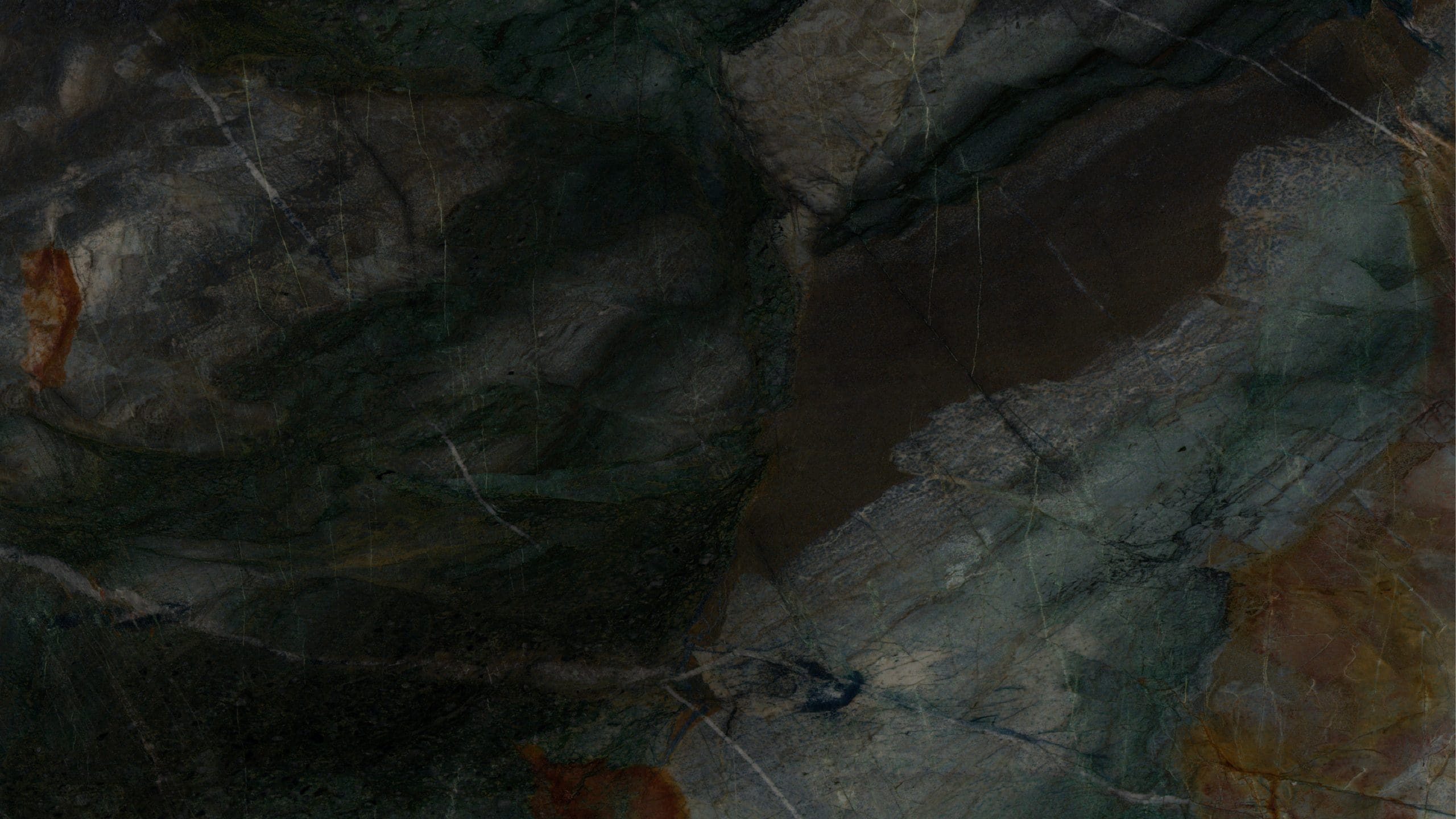 Dark textured stone surface with earthy hues