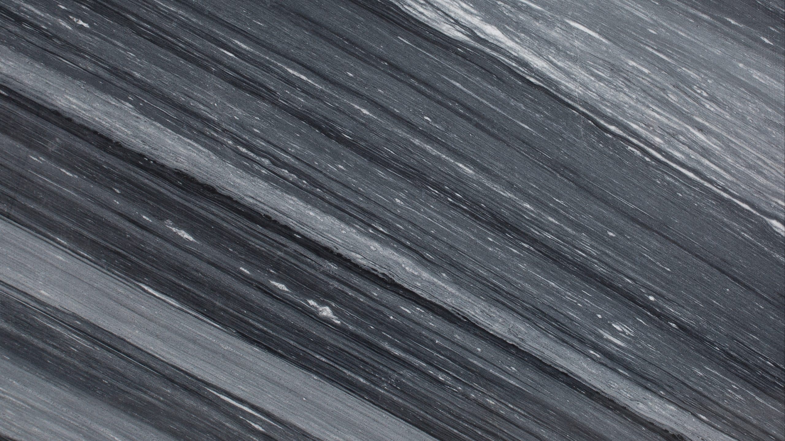 Close-up of striated gray stone texture surface.