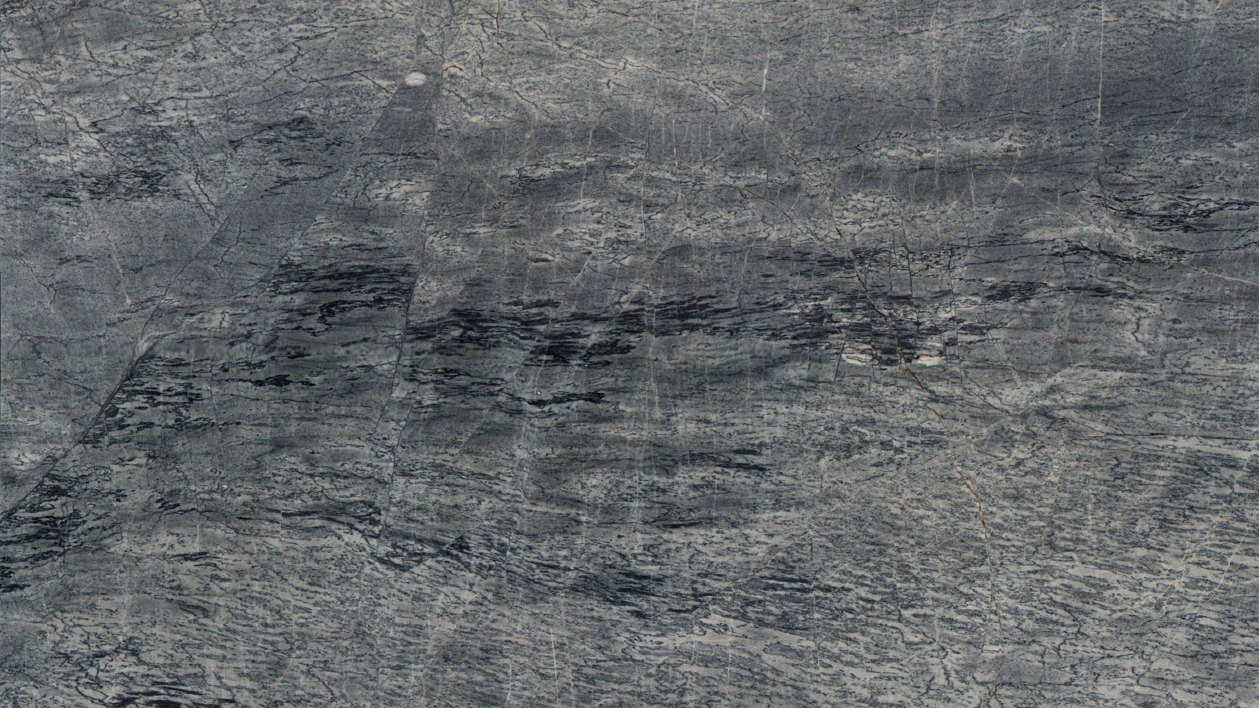 Close-up of textured gray stone surface.