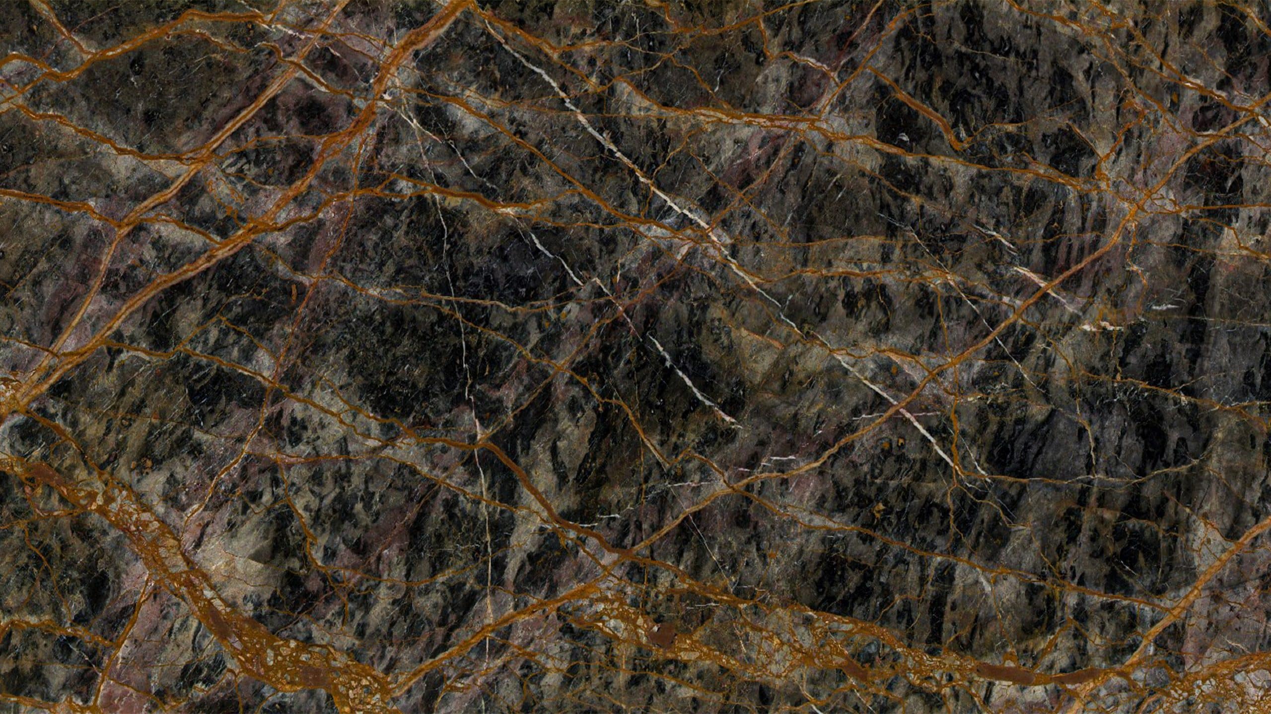 Dark marble with orange and white veins.