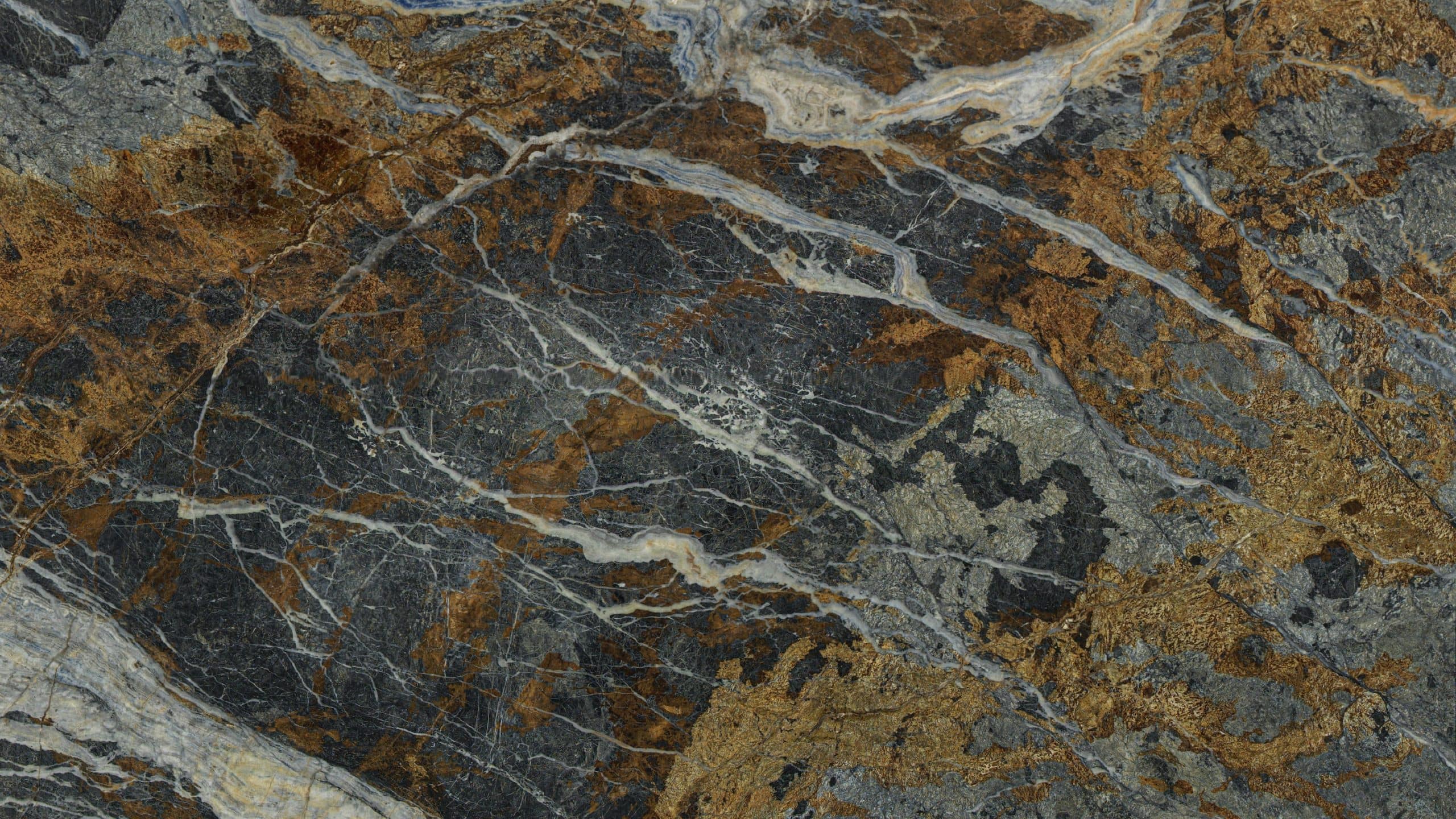Close-up of textured, multicolored natural stone surface.
