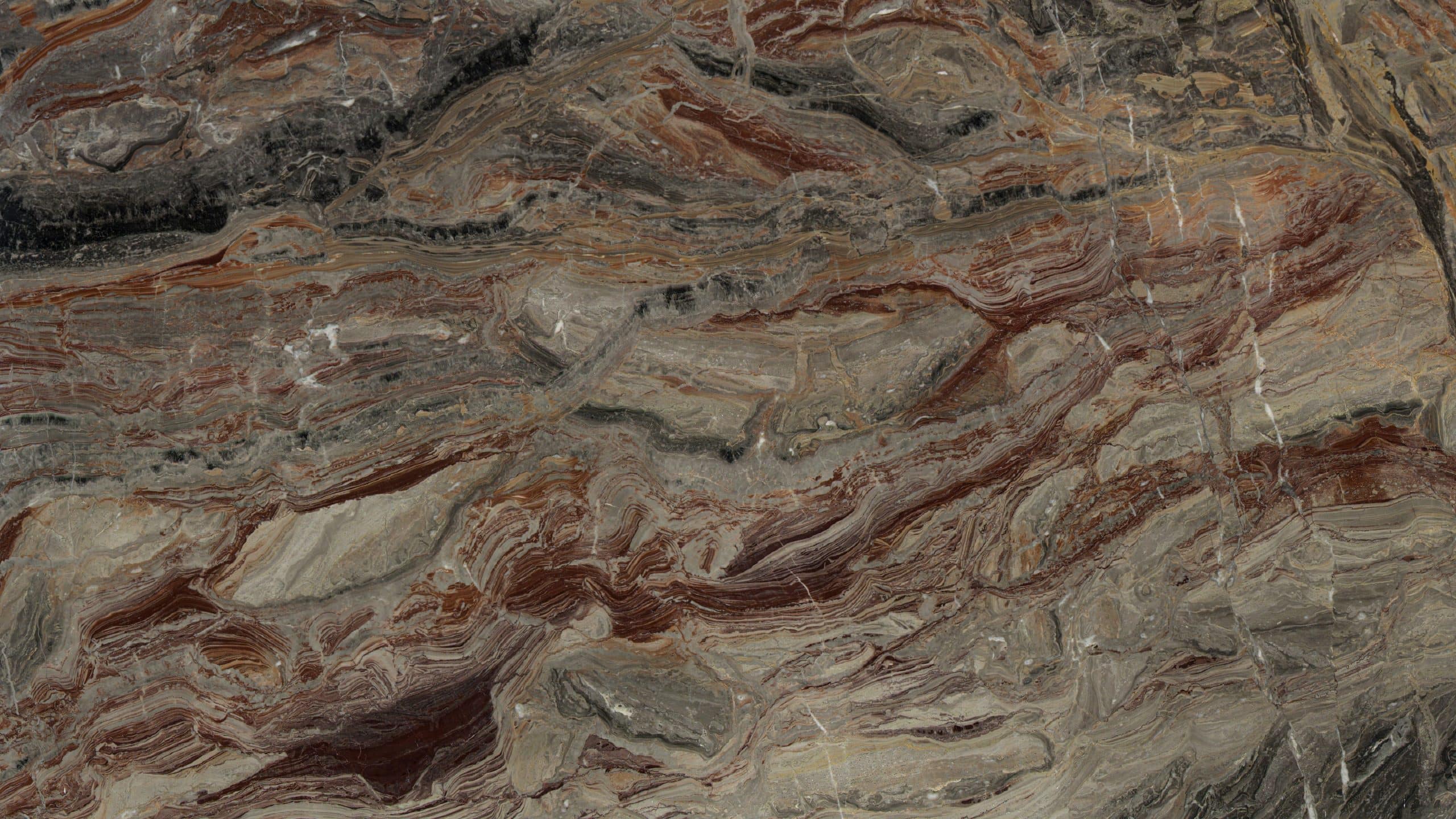 Close-up of colorful, layered rock formation texture