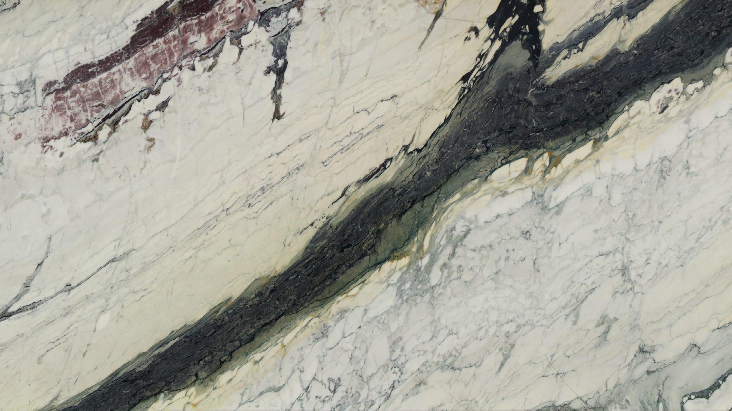 Close-up of textured marble surface with dark veins.