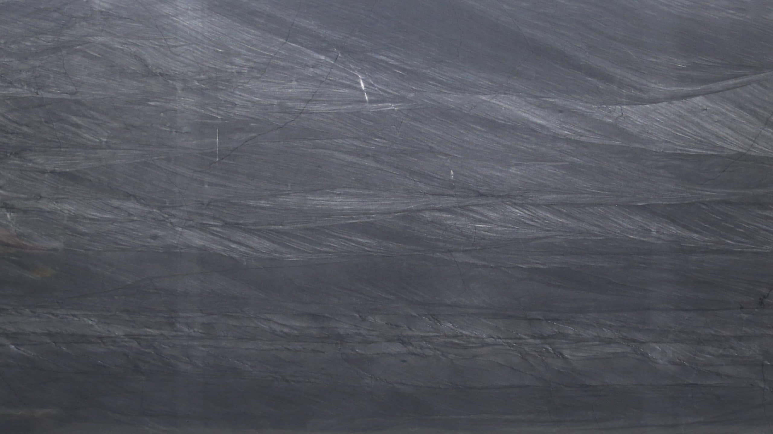 Gray textured stone surface with natural patterns