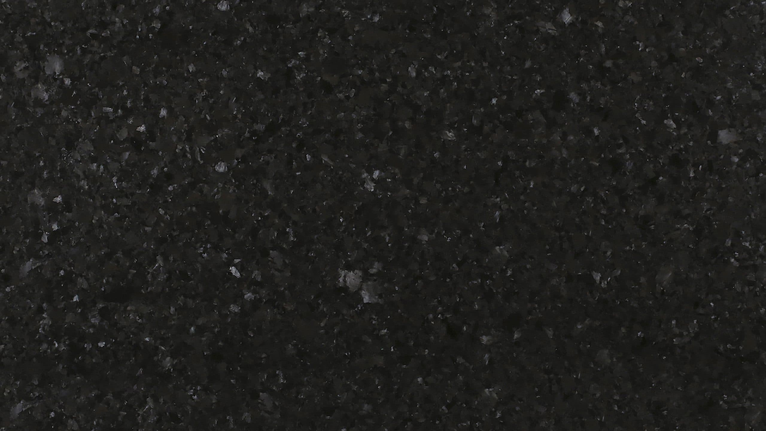 Closeup of black granite texture surface.