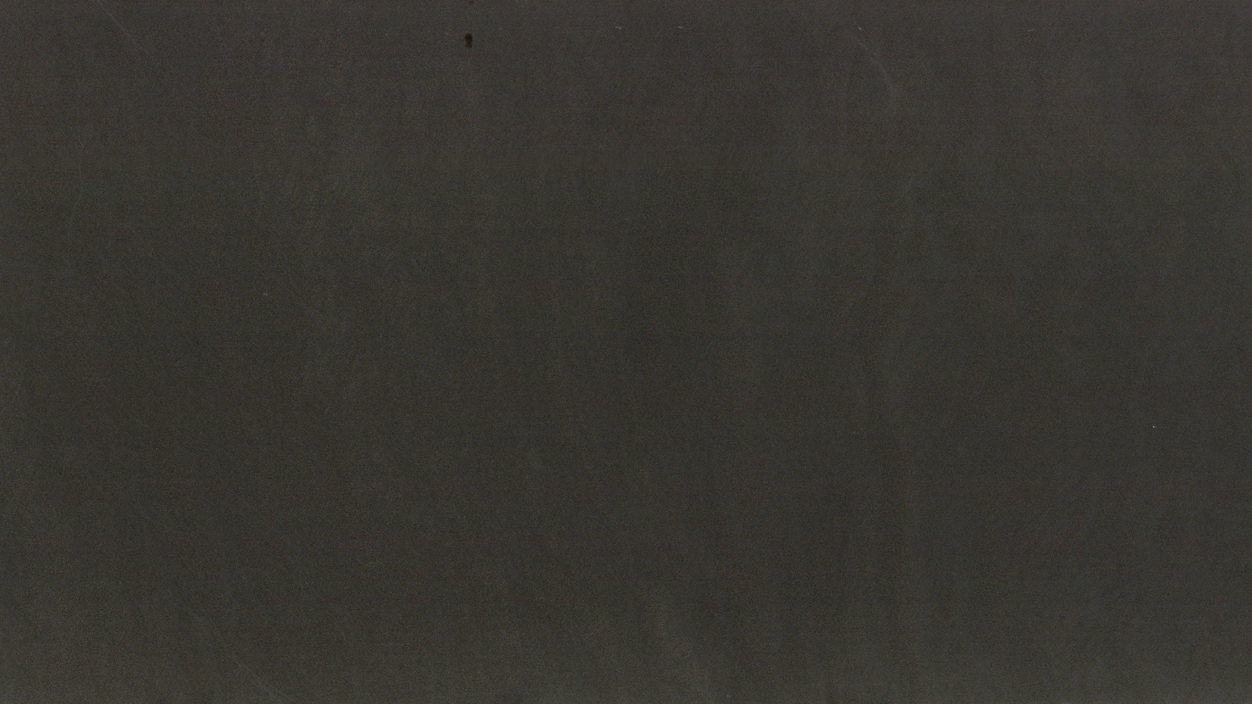 Wooden black textured surface close-up