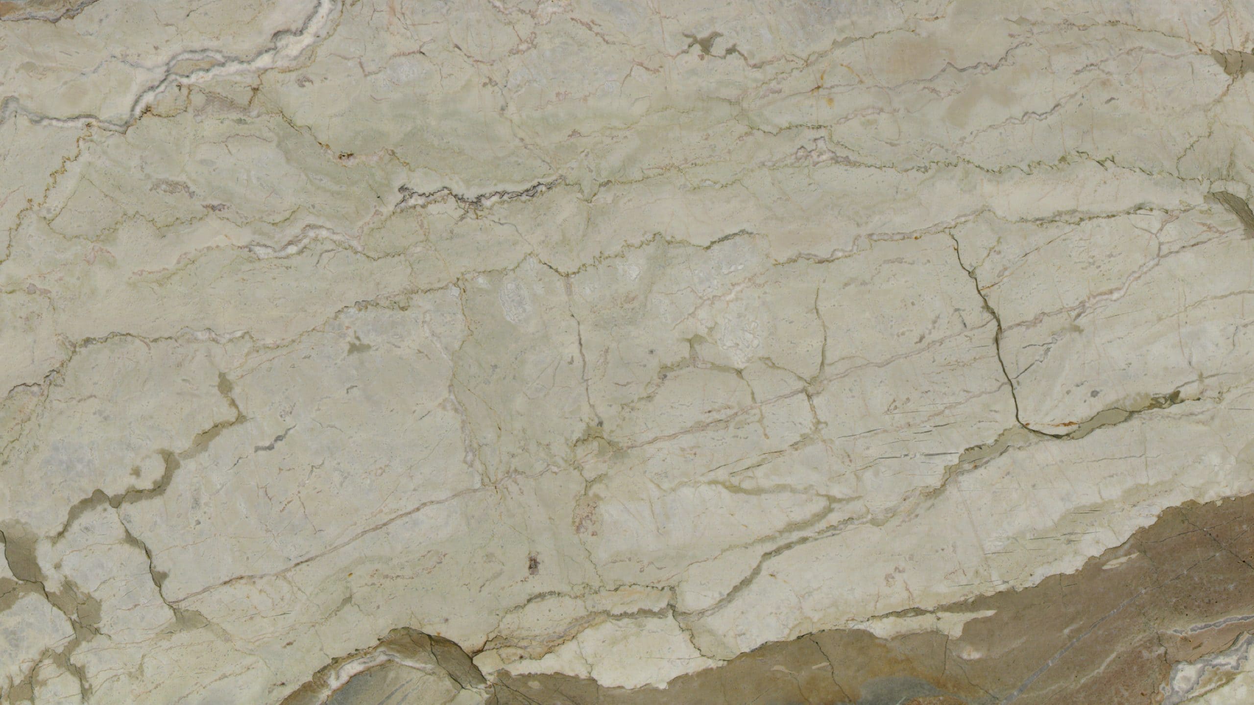 Textured beige marble surface with natural veins.
