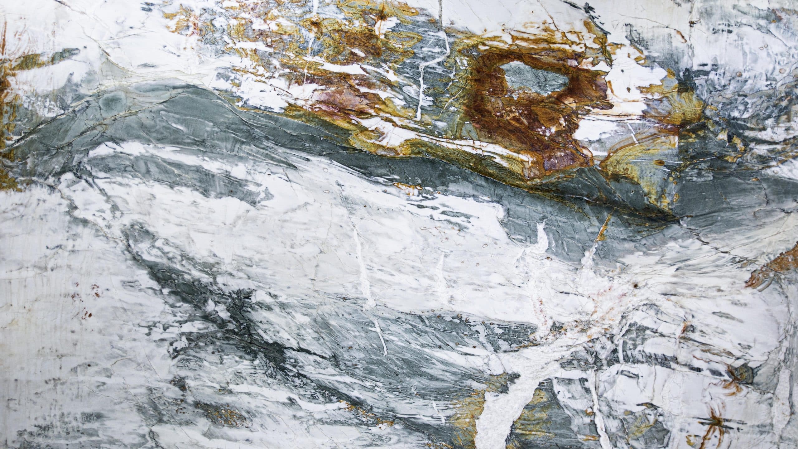 Colorful marble texture with gray and brown patterns.