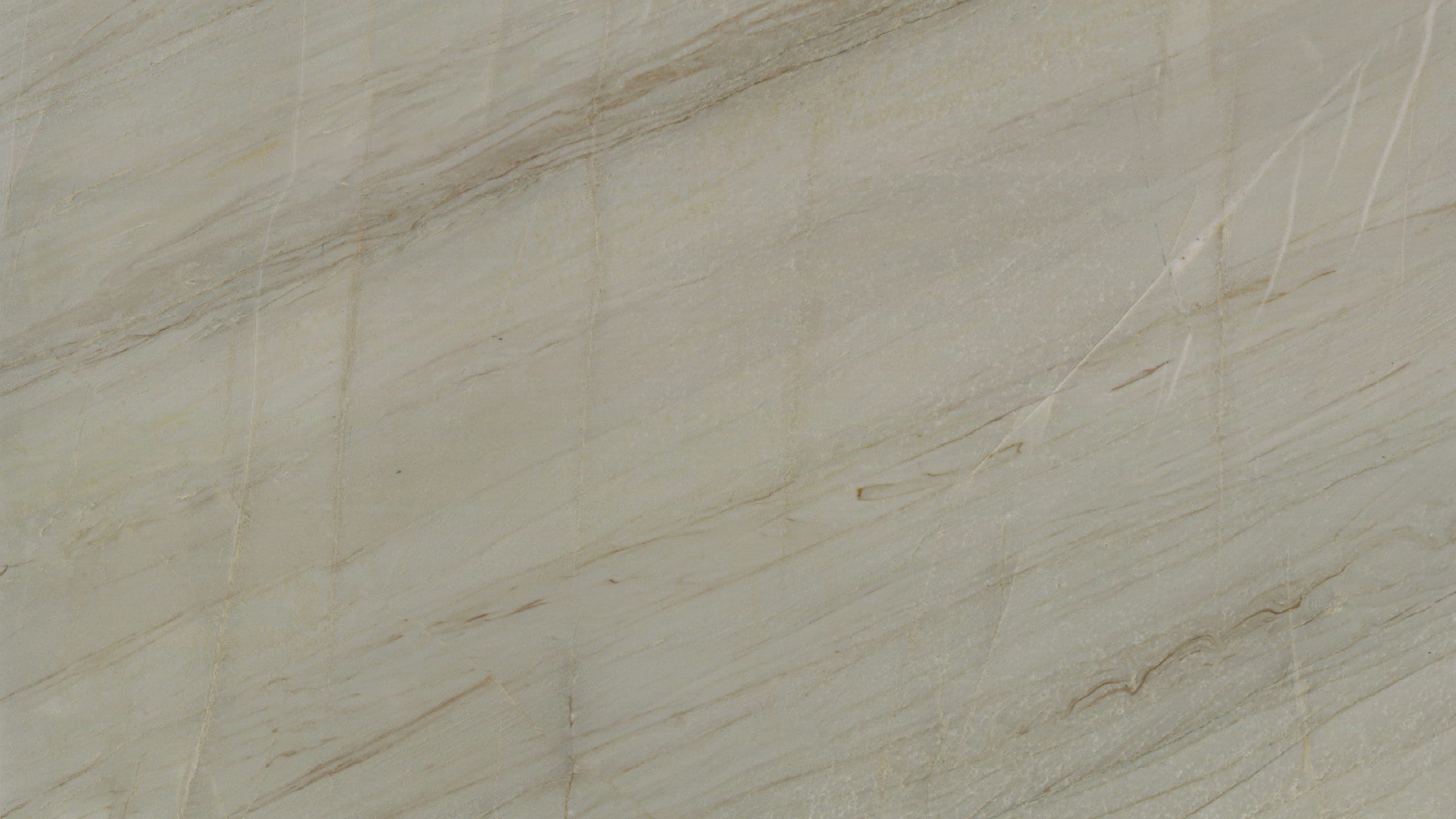 Close-up of beige marble texture with natural veins.