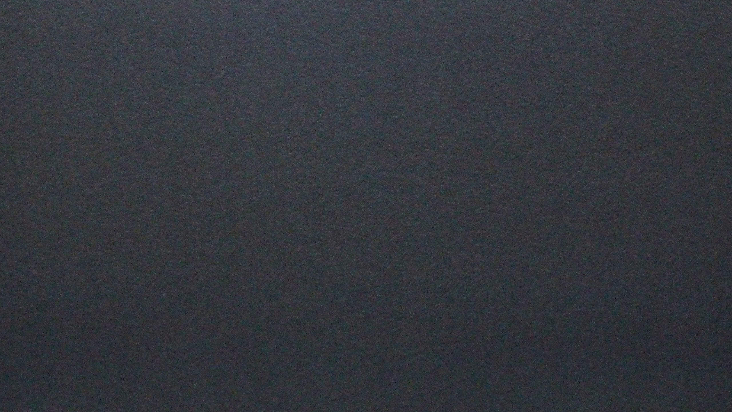 Smooth close-up of a gray carpet texture.