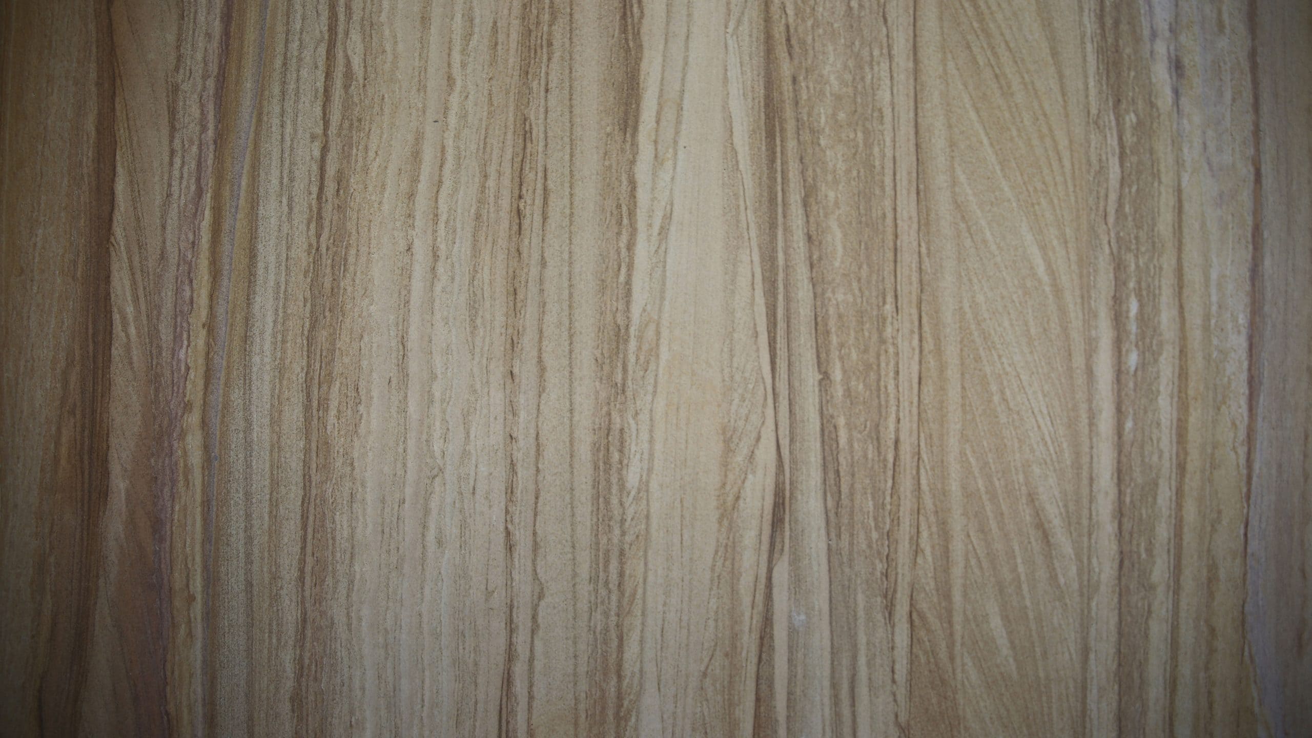 Natural wood grain surface texture close-up.