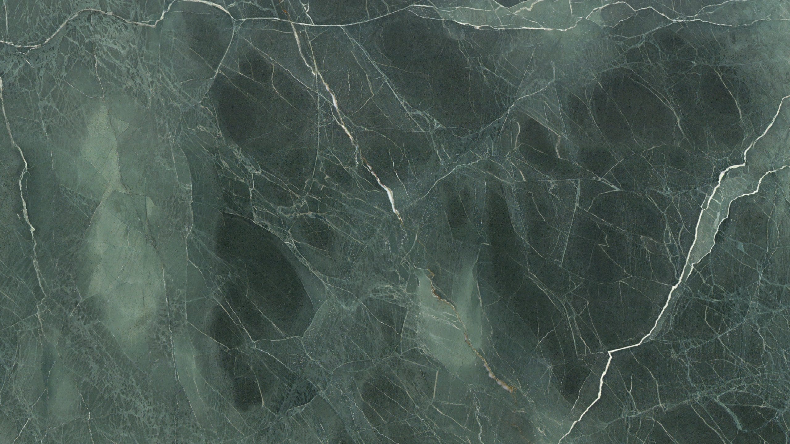 Close-up of dark green marble texture with veins.