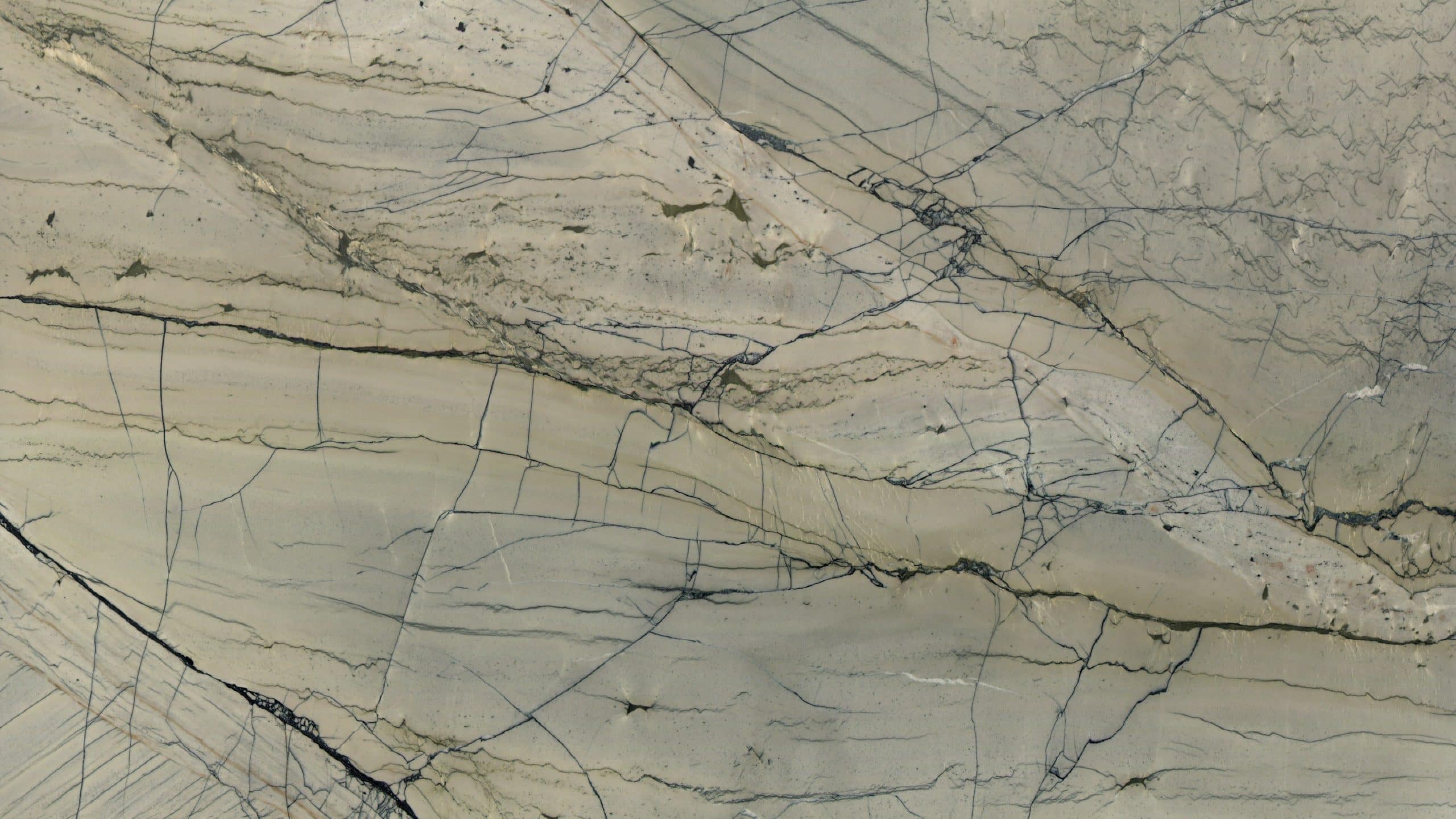 Close-up of cracked beige marble surface