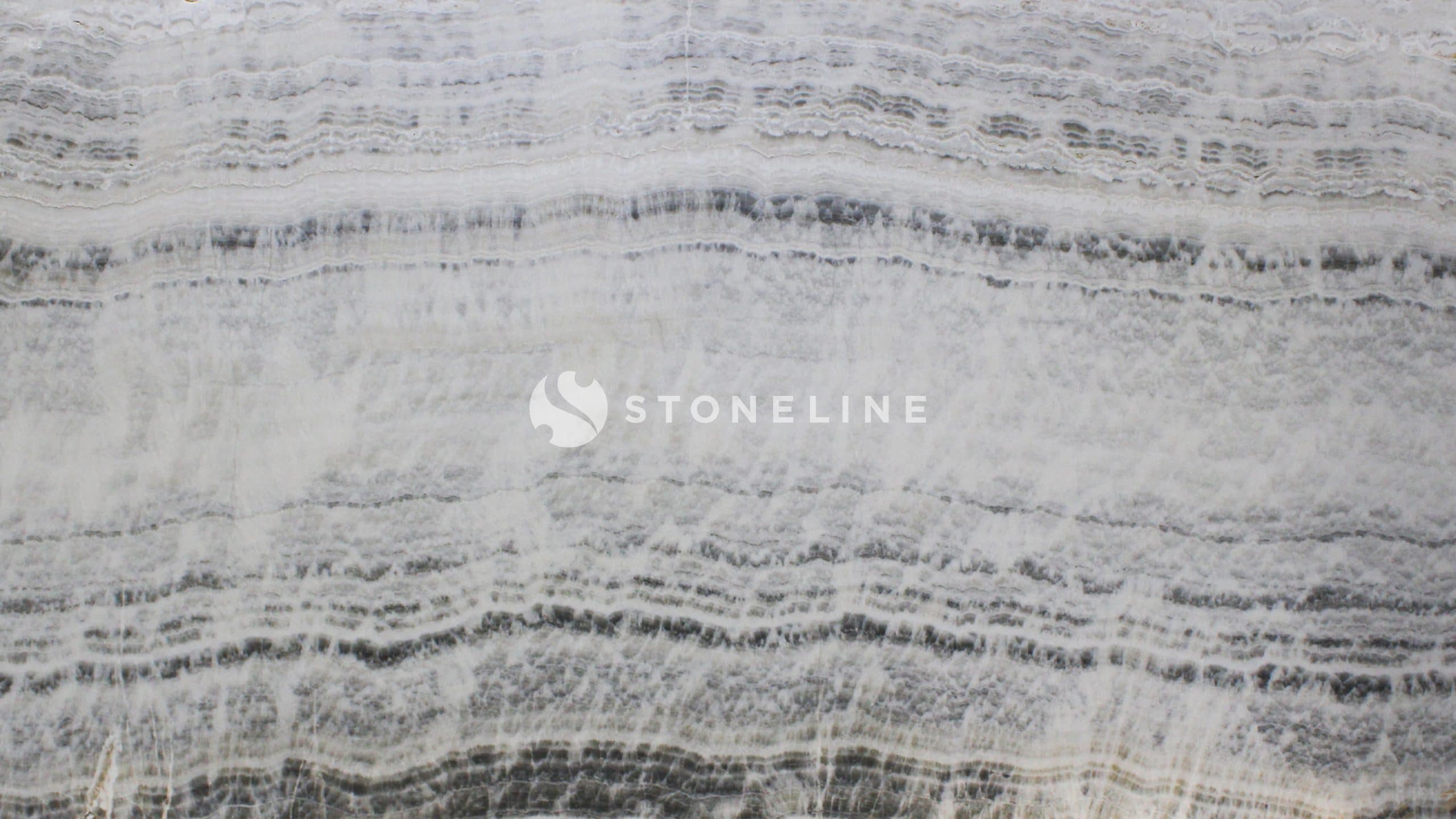 Close-up of textured gray and white marble surface.