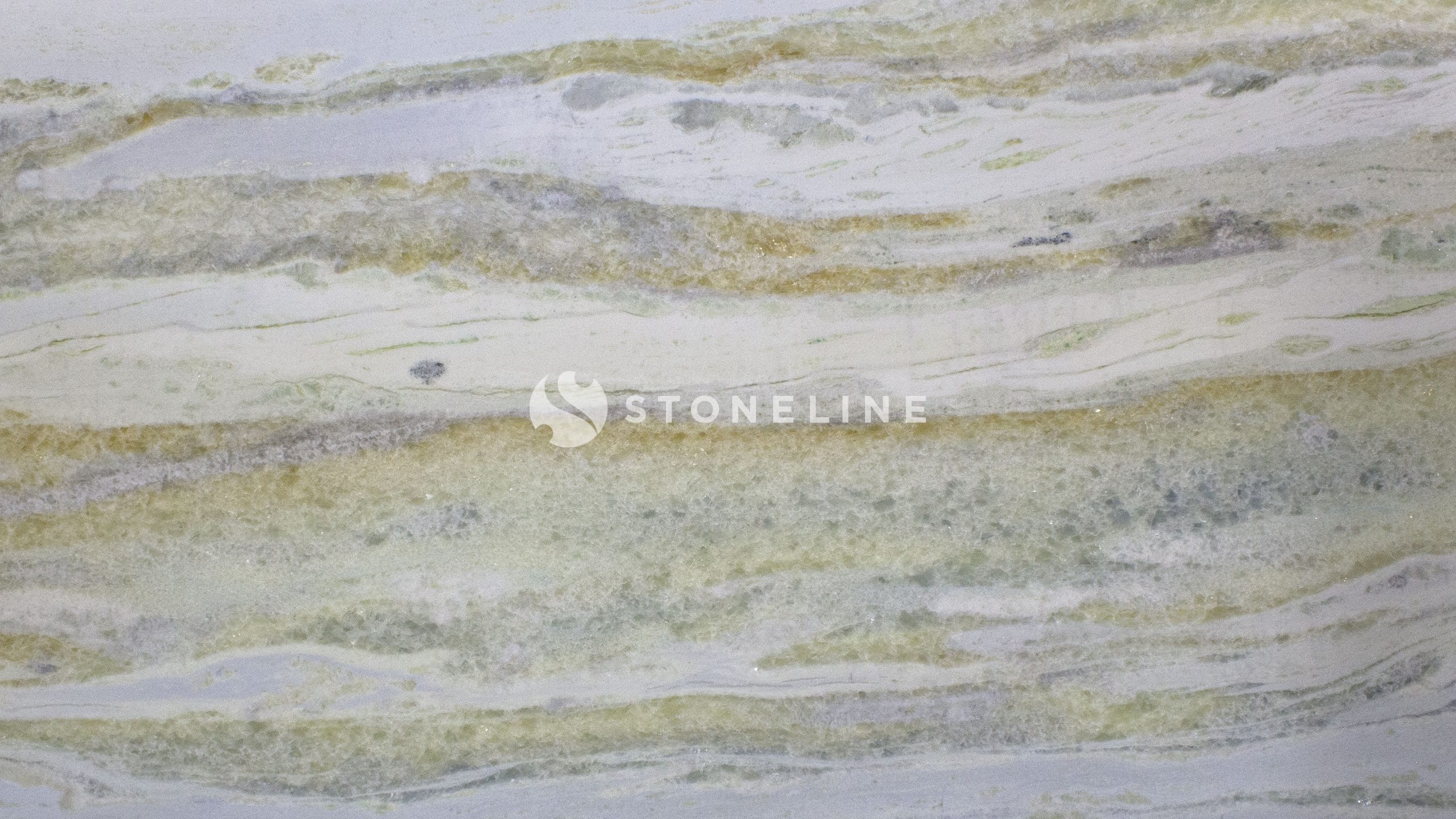 Polished marble stone with green and beige veins