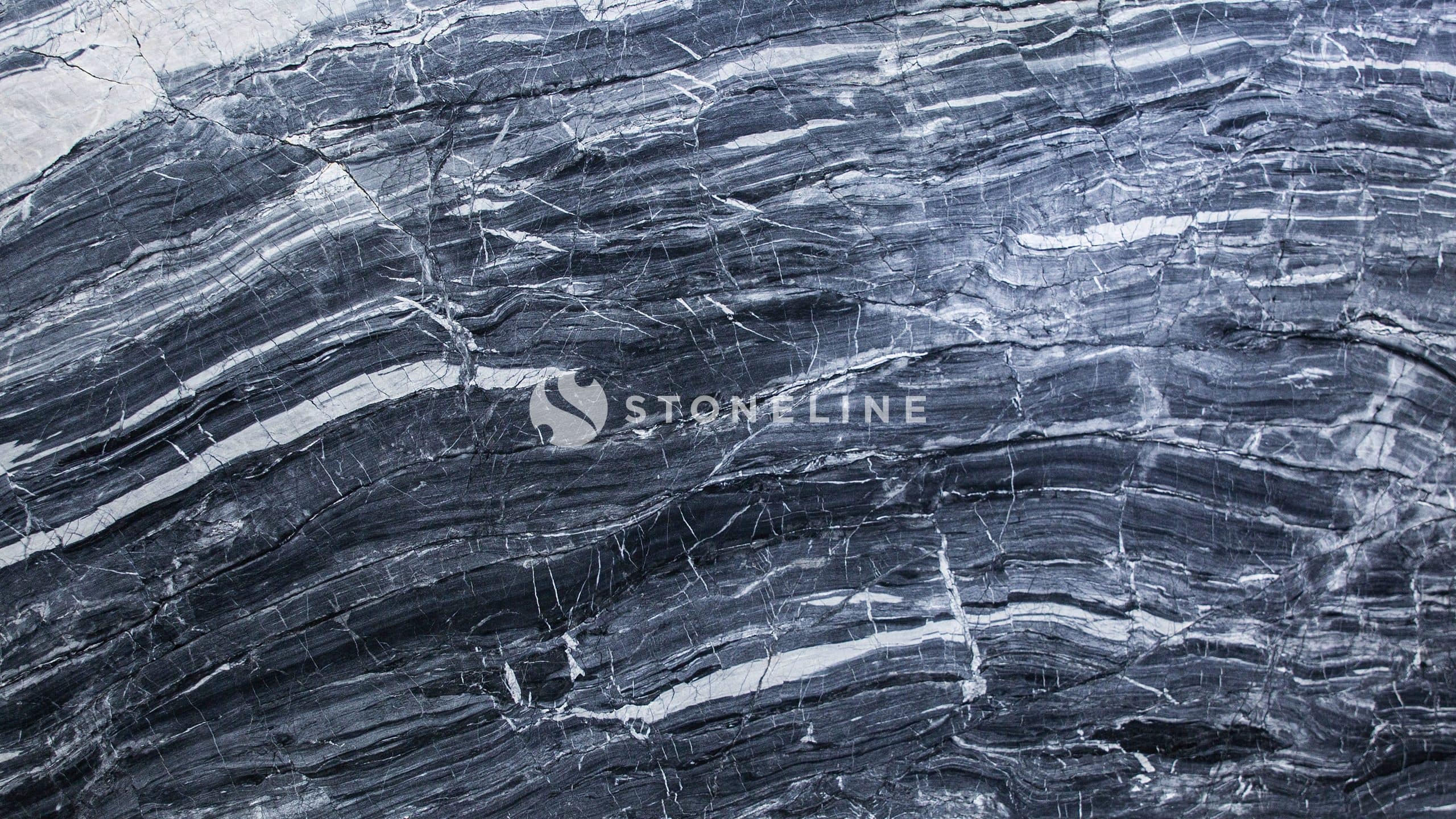 Close-up of textured dark gray marble surface.