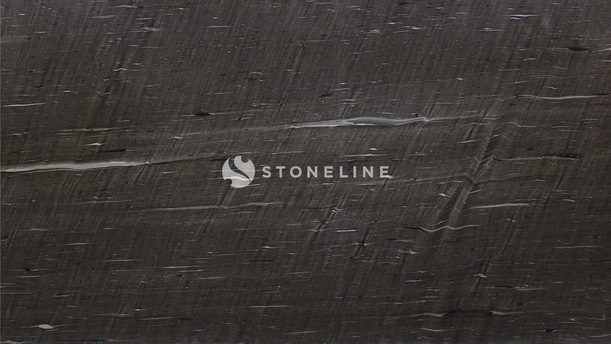 Closeup of dark textured surface.