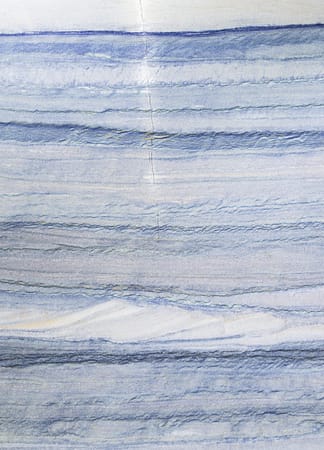 Blue and white marble texture with wavy patterns.