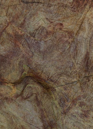 Textured brown marble surface with natural patterns.