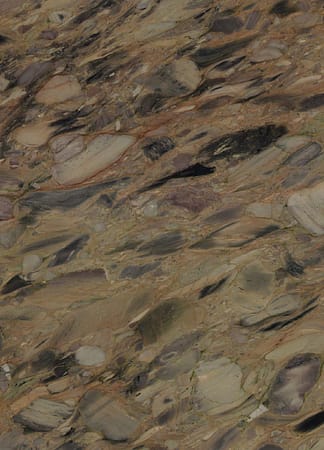 Close-up of textured stone surface with mixed colors.