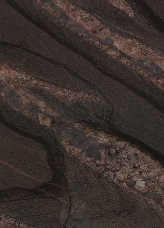 Close-up of dark, swirling rock patterns