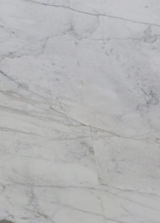 Close-up of white marble surface with veins