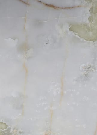 Close-up of light marble texture with veins.