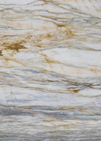 White and gold textured marble surface.