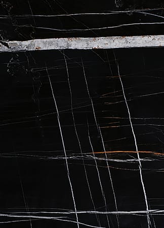 Black marble with white veins texture.