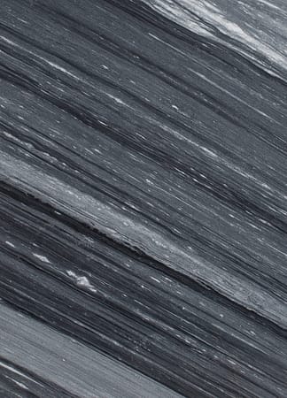 Close-up of striated gray stone texture surface.