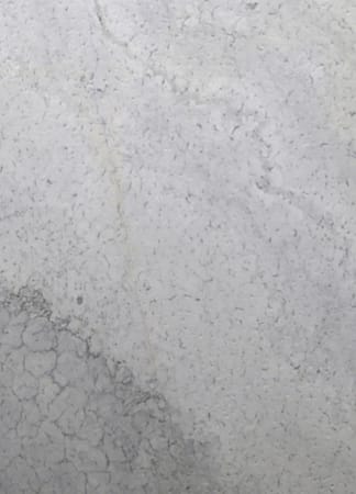 Close-up of textured gray concrete wall surface.