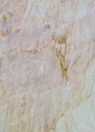Close-up of beige marble texture with veins